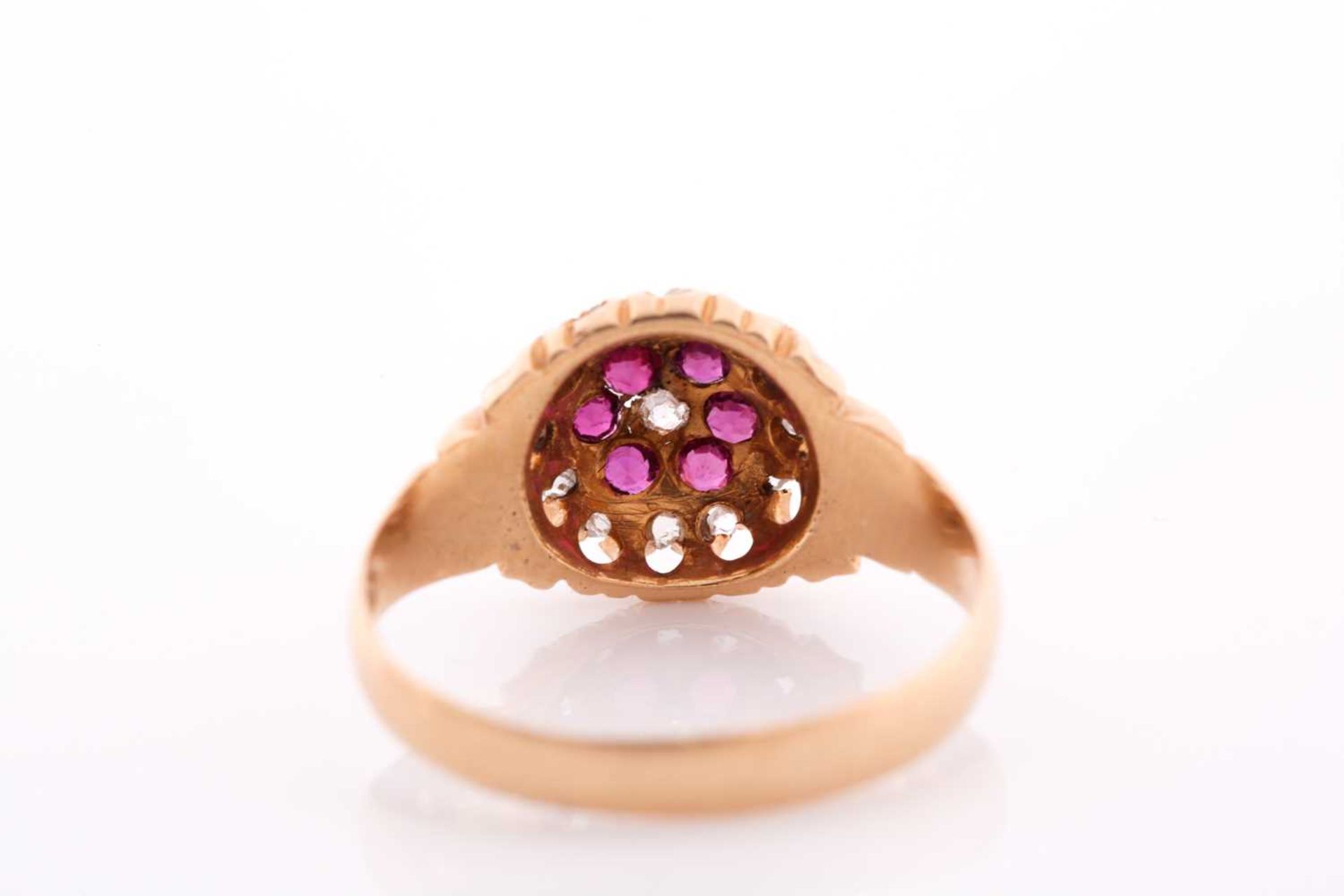 An 18ct yellow gold, diamond, and ruby floral cluster ring, the claw-raised mount pave-set with - Image 4 of 5
