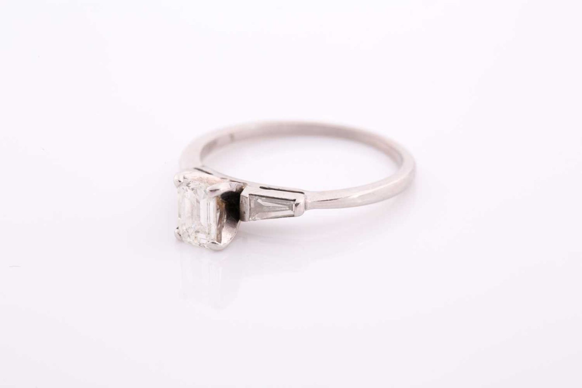 An 18ct white gold and diamond ring, set with an emerald-cut diamond of approximately 0.60 carats, - Image 3 of 4