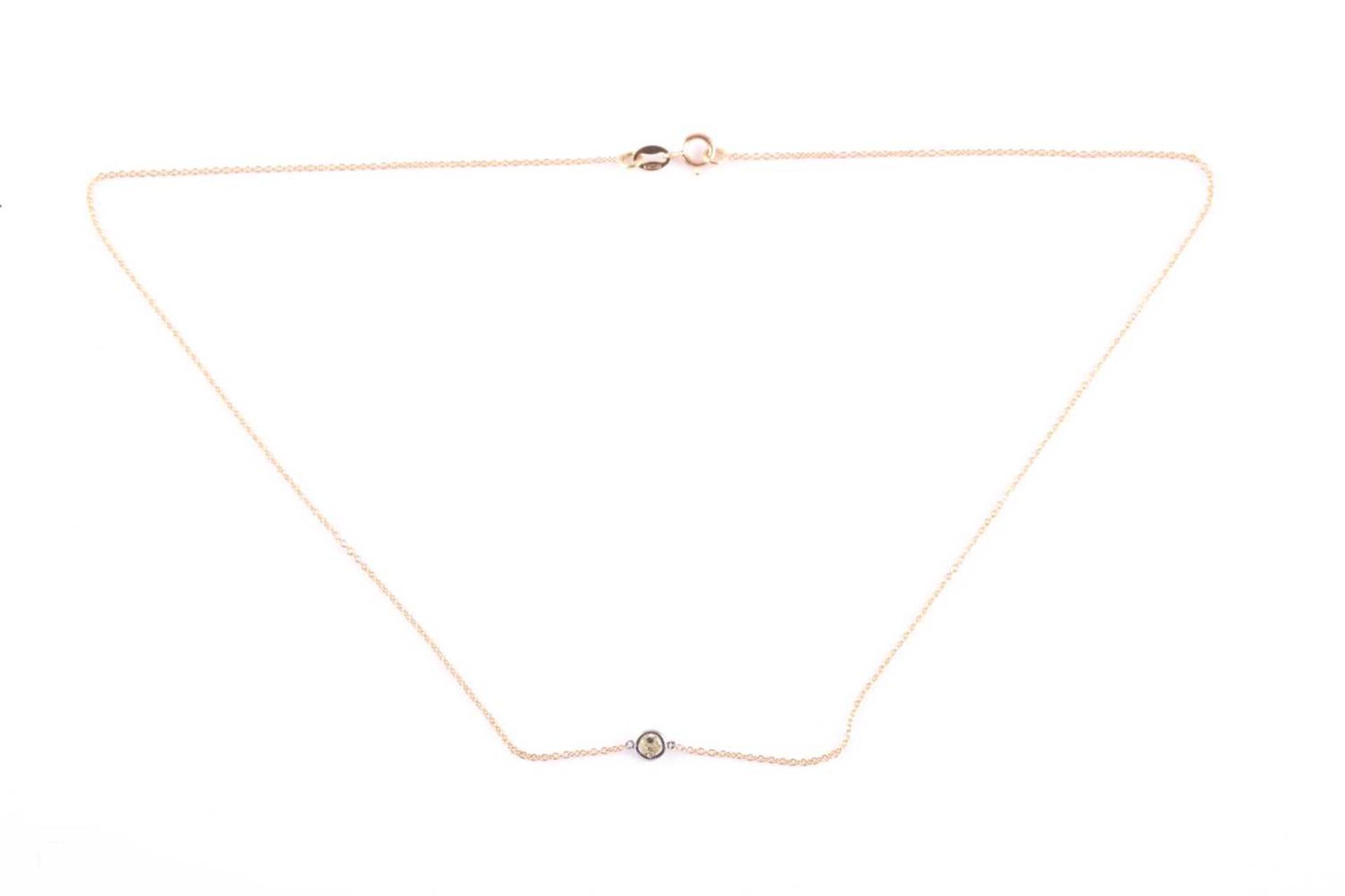 An 18ct yellow gold and diamond necklace, the chain set with a collet-mounted round brilliant-cut