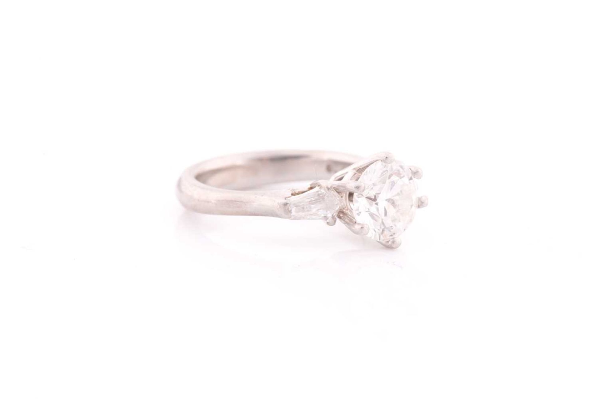 A platinum and diamond ring, set with a round brilliant-cut diamond of approximately 1.50 carats, - Image 4 of 4