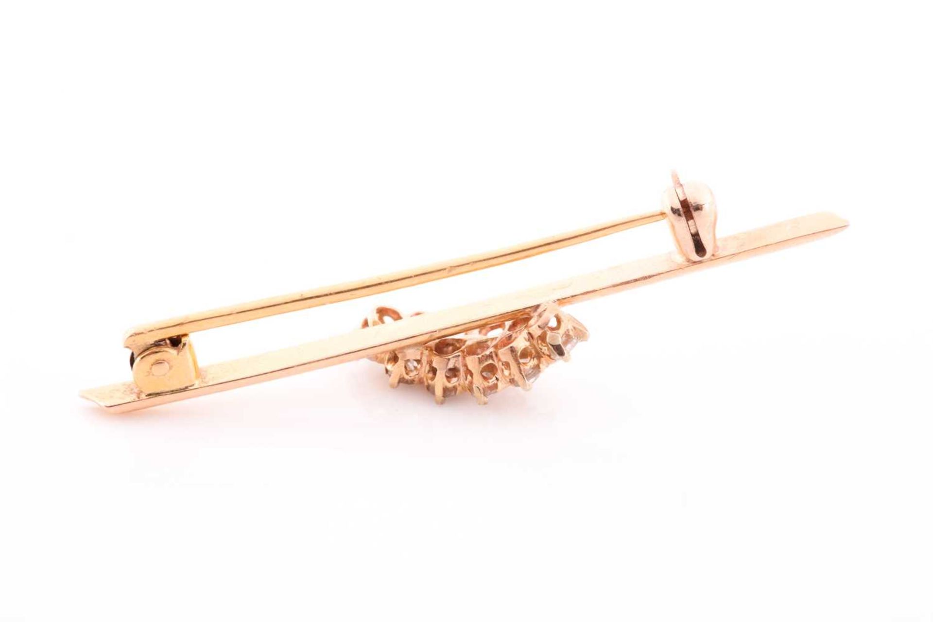 A yellow metal and diamond bar brooch, set with ten round brilliant-cut diamonds of approximately - Image 3 of 3