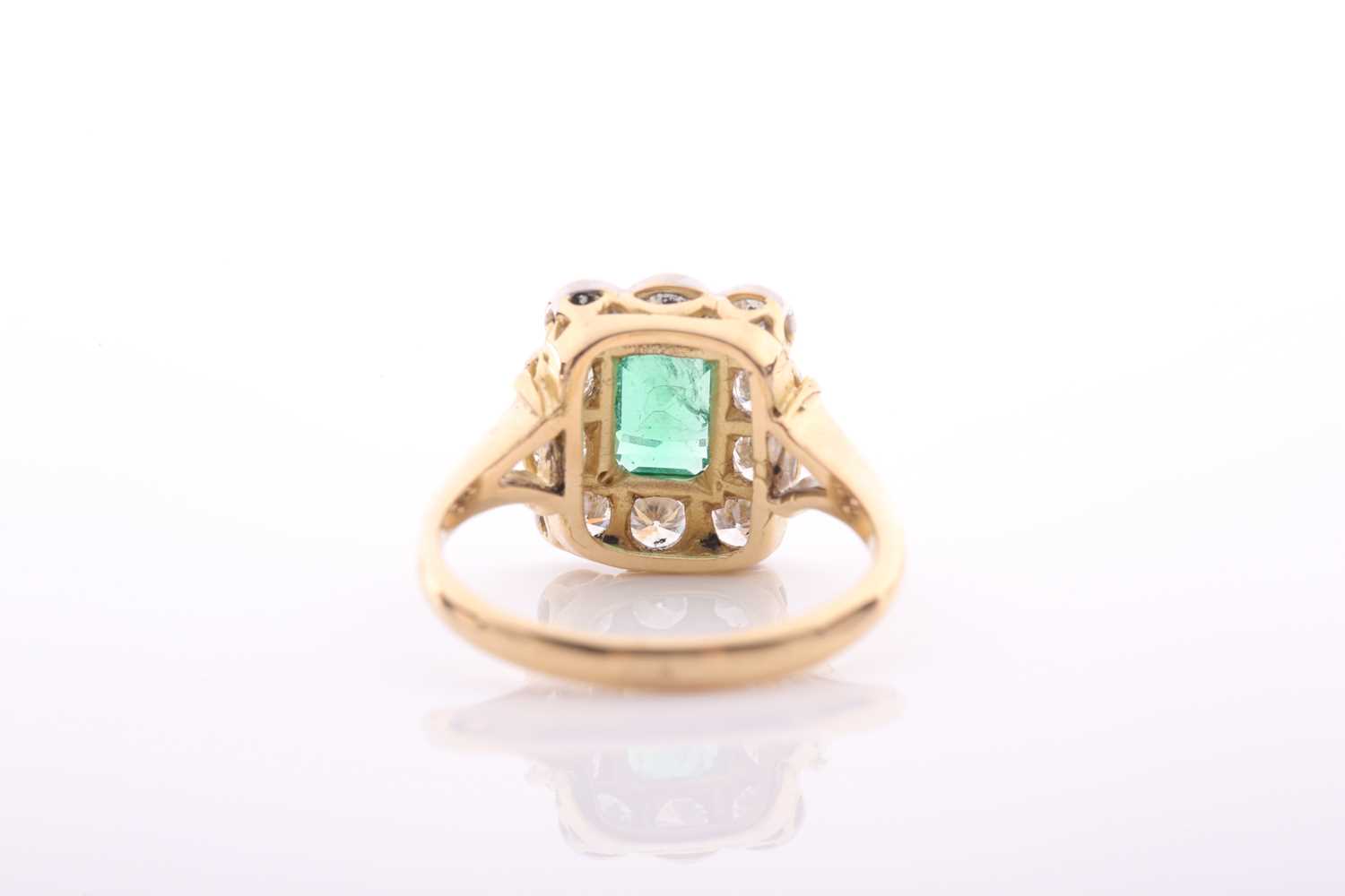 An emerald and diamond rectangular cluster ring, centred with an emerald-cut emerald, - Image 2 of 5