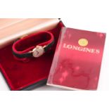 Longines, a lady’s 9ct gold small round wrist watch, circa 1973, silvered dial with raised black