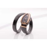 Bulgari. A lady’s Serpenti Spiga single spiral watch; with black ceramic Tubogas bracelet; 35 mm