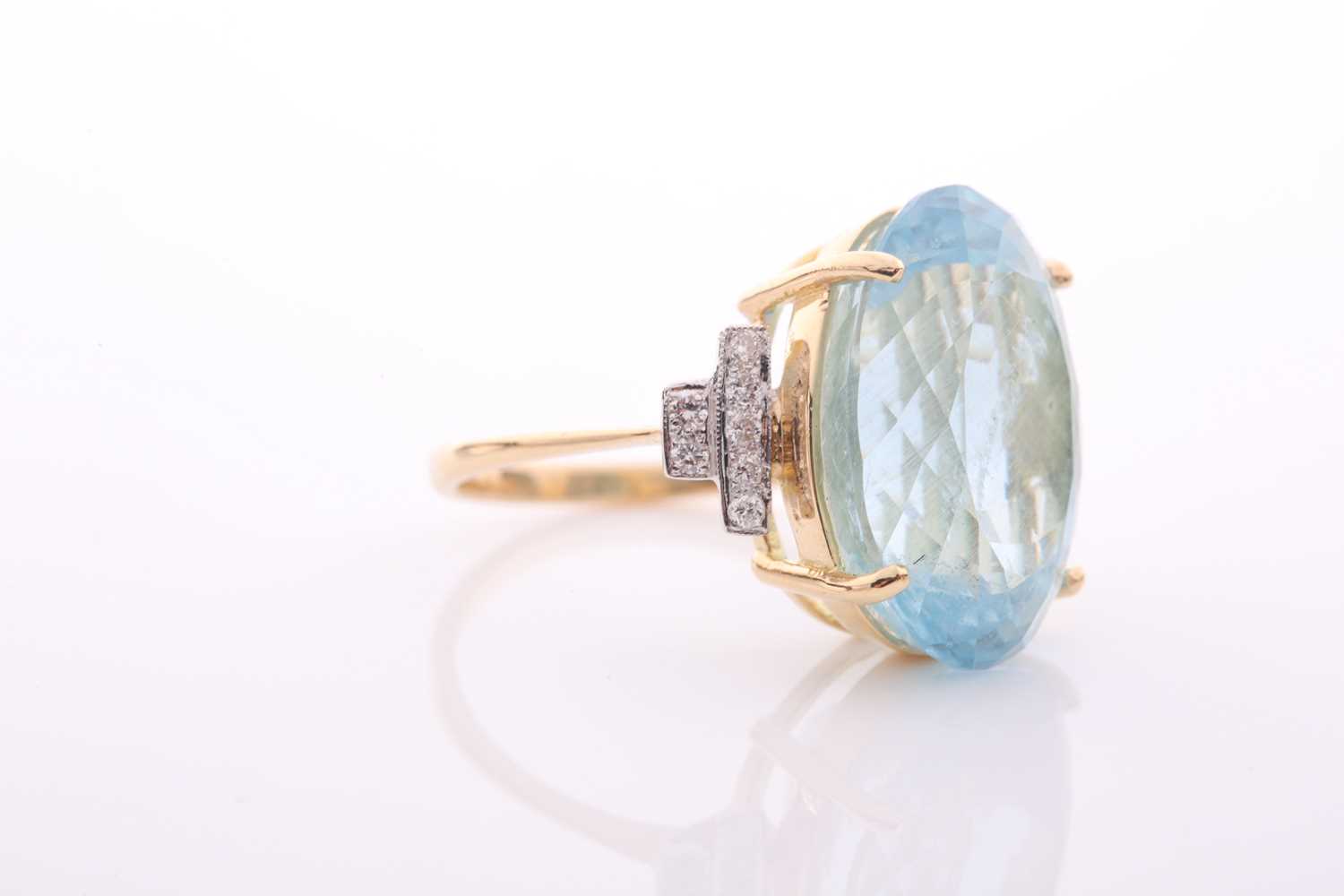 A modern aquamarine and diamond dress ring, centred with a large oval mixed-cut aquamarine, - Image 3 of 6