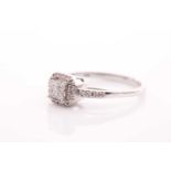 A 14ct white gold and diamond cluster ring, inset with four square-cut diamonds to centre within a