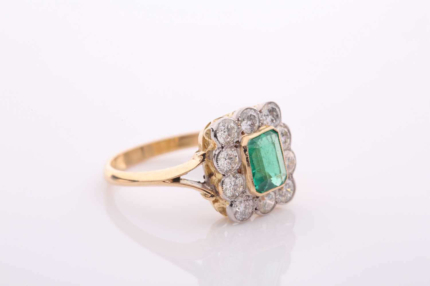 An emerald and diamond rectangular cluster ring, centred with an emerald-cut emerald, - Image 3 of 5