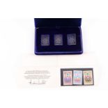 A cased set of three silver ingots, designed as stamps, in honour of the 1976 Summer Olympics,