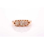 A late Victorian 18ct yellow gold and diamond ring, set with three old-cut diamonds of approximately