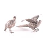 A silver pheasant cock and hen, each with import marks for Berthould Muller, 1910 & 1913,