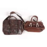 A Prada brown leather handbag with chrome mounts and zip fastening, together with a Prada brown