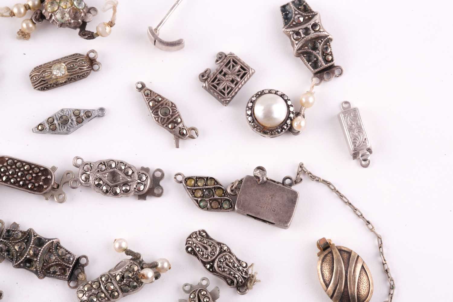 A mixed group of various silver and marcasite set necklace clasps, of various designs and sizes. - Image 2 of 5