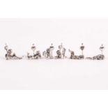 A set of six modern cast silver cherub name placeholders. Bearing import marks. Each figure in