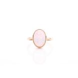 A single stone opal ring, the oval opal in rub-over mount to plain 9 carat gold shank, opal 14mm x
