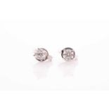 A pair of solitaire diamond earrings, set with round brilliant-cut diamonds of approximately 0.40