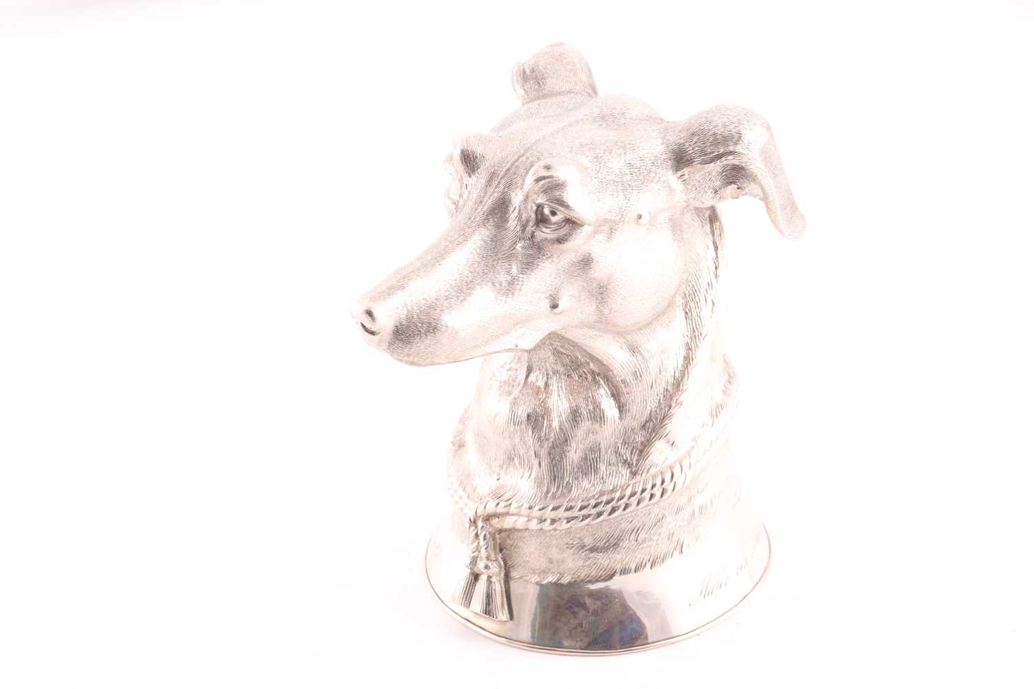 A late 19th century (?) German cast silver stirrup cup modelled as the head of a long dog/ greyhound
