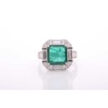 An emerald and diamond square cluster ring, centred with an emerald-cut emerald, approximately 4.