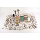 A large quantity of mixed silver including photograph frames, sugar tongs, vases and other items