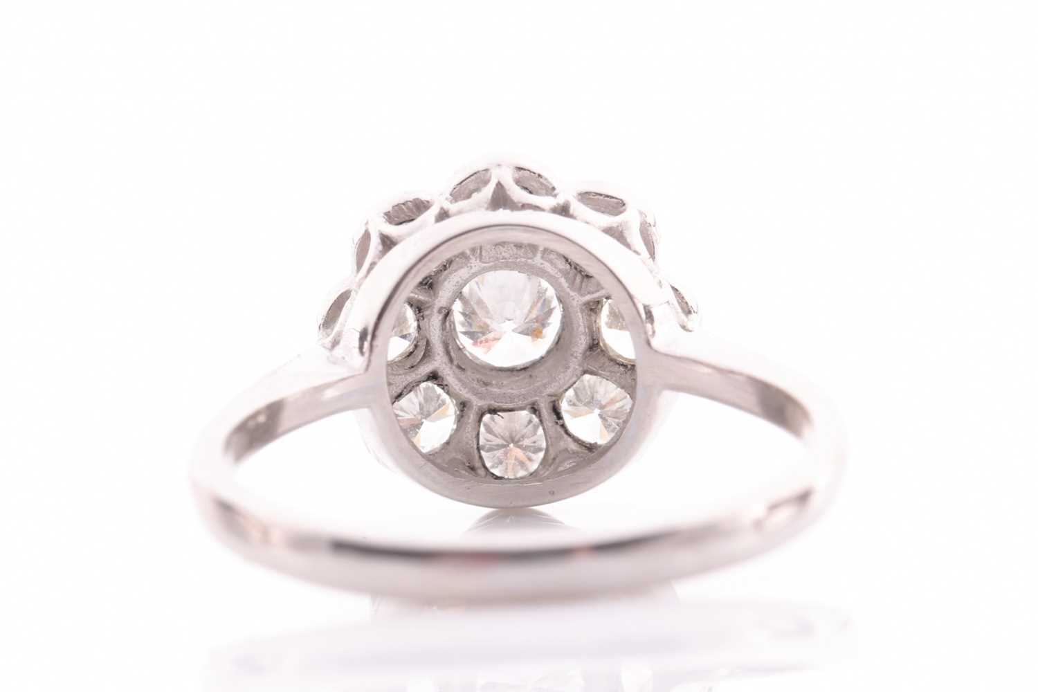 A platinum and diamond daisy cluster ring, set with round-cut diamonds of approximately 1.0 carats - Image 4 of 4