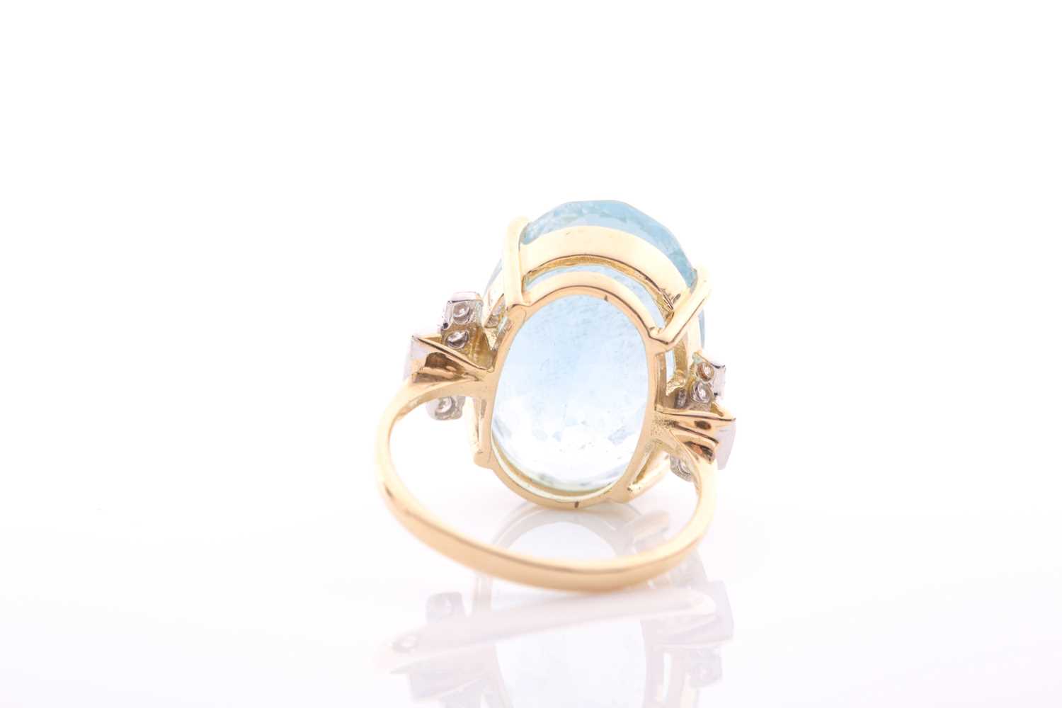 A modern aquamarine and diamond dress ring, centred with a large oval mixed-cut aquamarine, - Image 5 of 6