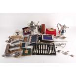 A collection of silver to include a Chinese silver butter knife, napkin rings, dressing table