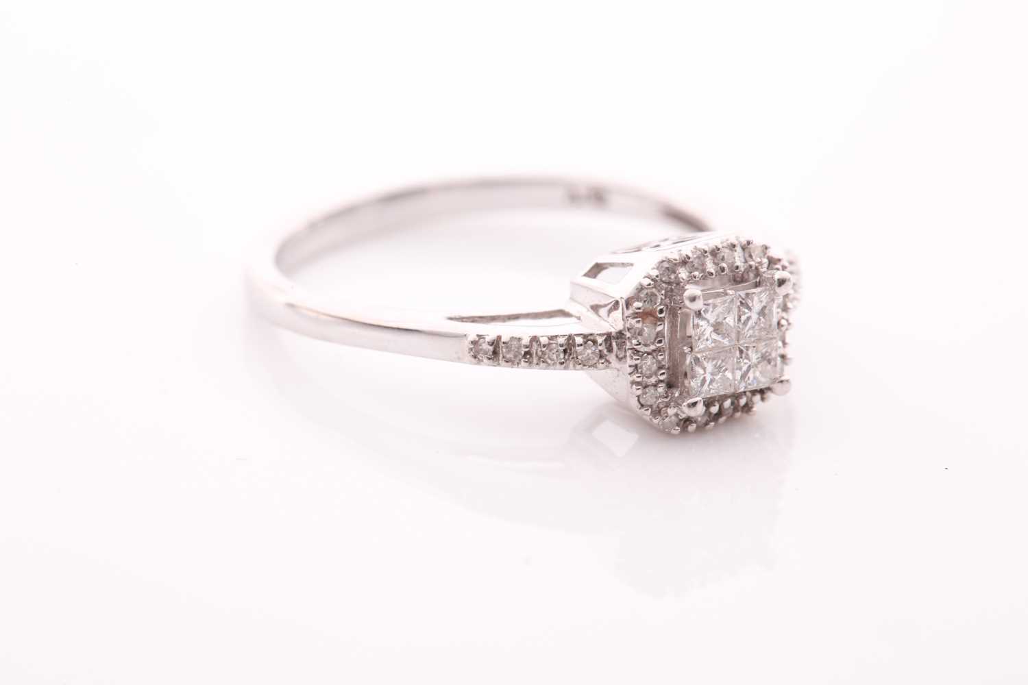 A 14ct white gold and diamond cluster ring, inset with four square-cut diamonds to centre within a - Image 2 of 4