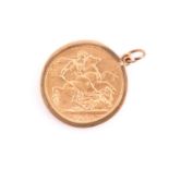 A Victorian 1893 old head gold sovereign. In a 9ct gold loose captive mount.Condition report: 9