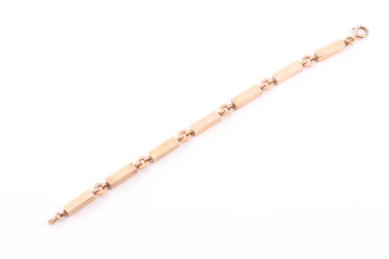 An early 20th century 9ct rose gold block bracelet, in the form of seven rectangular blocks with