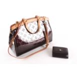 A Louis Vuitton dark maroon patent leather handbag, with zipped fastening, two loop handles and