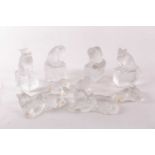 A collection of eight Lalique frosted cat figures and one Sevres cat figure in various poses each