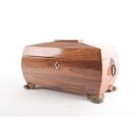 A Regency Kingwood two-section sarcophagus tea caddy.With satinwood stringing at the angles. With