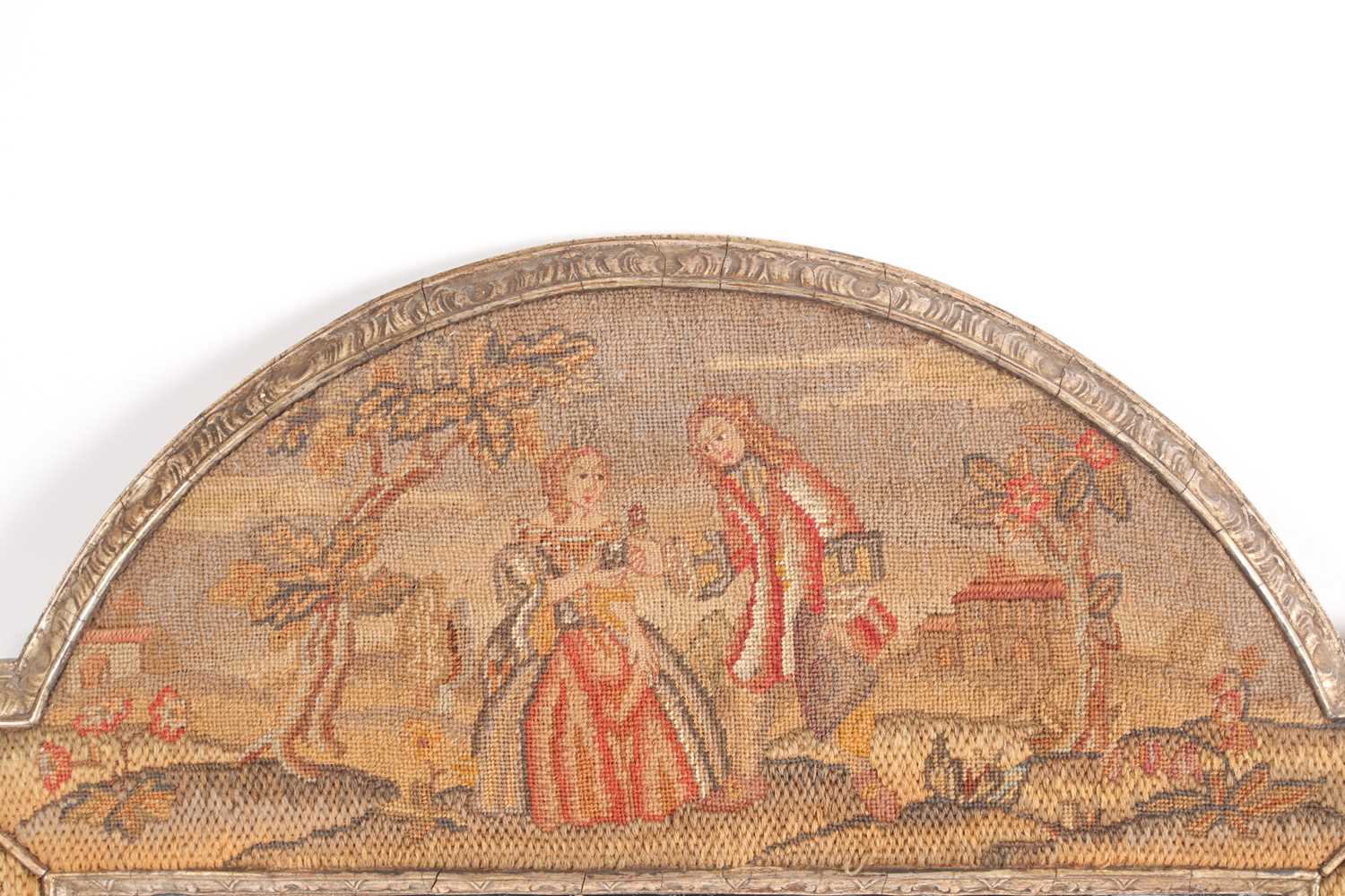 A Charles II style needlework wall mirror, the carved and silvered frame with embroidered scenes - Image 2 of 3