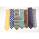 Five Hermes silk ties, two with original presentation slips, a Salvatore Ferragamo silk tie and a