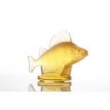 A Lalique yellow frosted glass perch car mascot figure on a circular base, with engraved 'Lalique