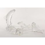 A Waterford crystal figure of a leaping salmon. 22 cm high. Together with three Baccarat crystal