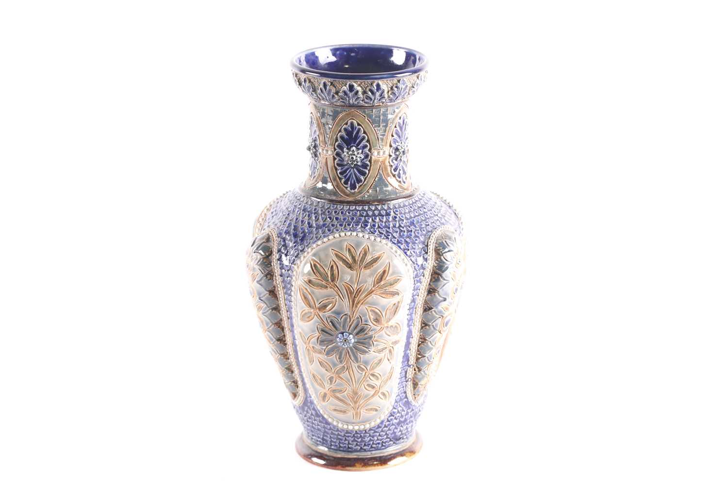 A Doulton Lambeth lobed vase, the rim with moulded leaves above the neck with foliate medallions,