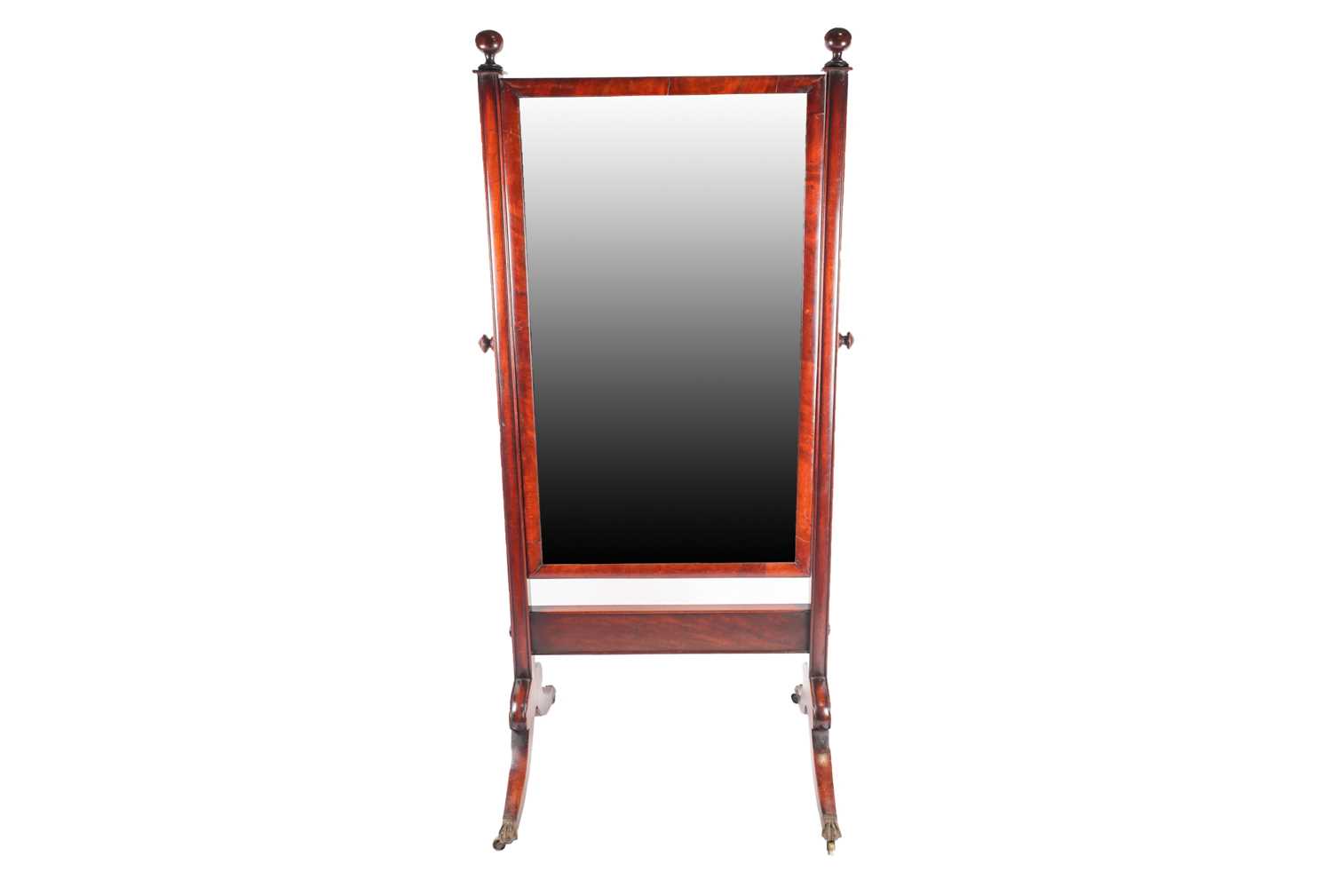 A George IV mahogany rectangular cheval dressing mirror. With turned sphere finials and moulded