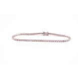 An 18ct white gold and diamond line bracelet, set with round brilliant-cut diamonds of approximately