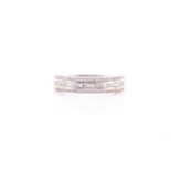 A platinum and diamond half eternity band, inset with rows of round and baguette-cut diamonds,