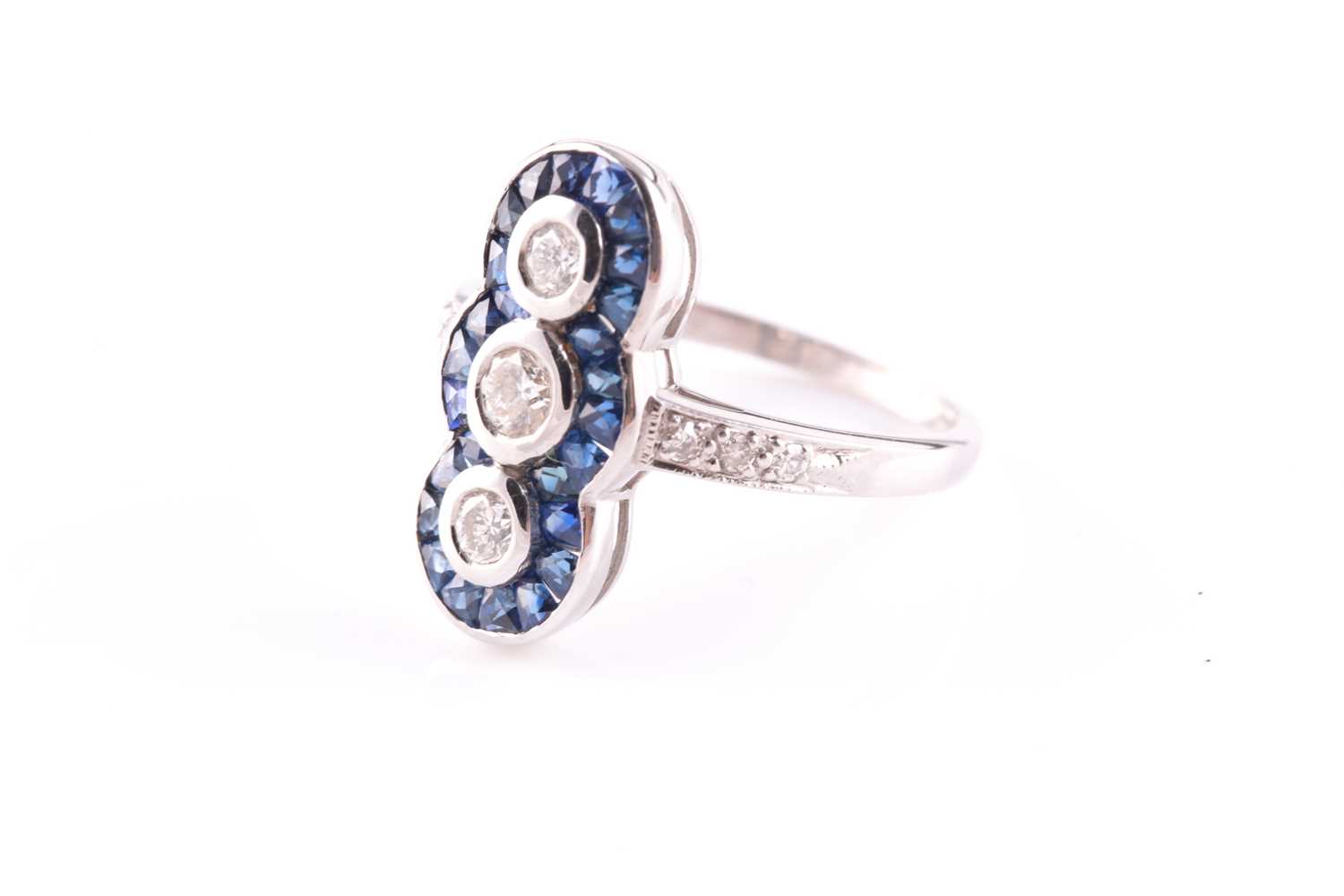 An 18ct white gold, diamond and sapphire ring, in the Art Deco style, the north to south mount inset - Image 2 of 3