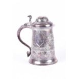A George III lidded tankard; London 1777, mark overstruck but probably that of William Cripps.