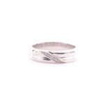 A 9 carat white gold and diamond ring; the wide reeded band with a seven stone diamond panel