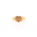 A yellow metal signet ring, the heart-shaped mount engraved with initials T.S., unmarked, size Q.