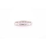 A diamond eternity band, the white metal shank later inset with diamonds (marks obscured by