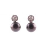 A pair of Tahitian pearl and diamond earrings, each with a diamond cluster, approximate diameter 8