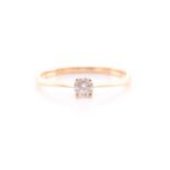 A solitaire diamond ring, the round brilliant cut diamond four claw set in 18 carat gold,