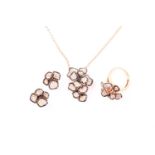 An 18ct rose gold, sapphire and diamond cluster pendant necklace pave set with mixed round-cut