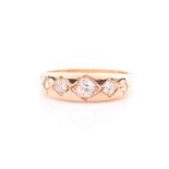 A five-stone diamond ring; the five gypsy set, graduated, old brilliant cut diamonds within a