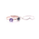 A 9ct rose gold and tanzanite ring, set with a round-cut stone of approximately 7 mm diameter,