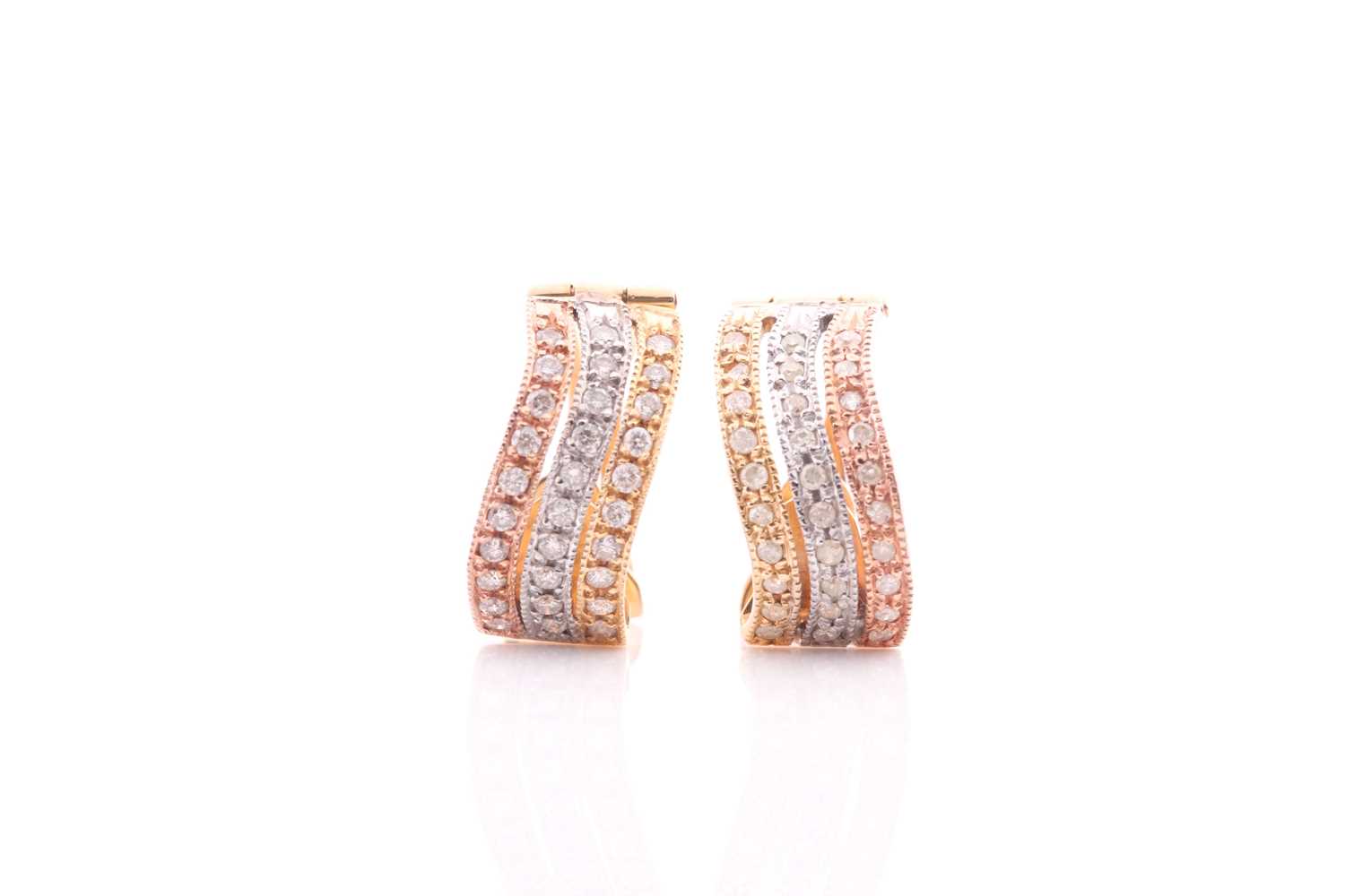 A pair of tri-coloured diamond hoop earrings, composed of three rows of circular cut diamonds within